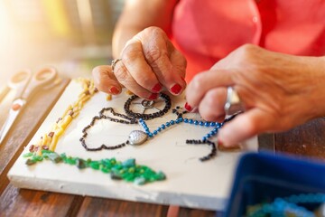 grandmother making crafts at home