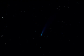 horizontal photograph of comet Neowise among the stars, taken from Spain