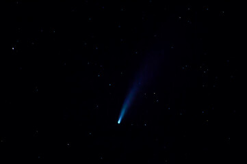 horizontal photograph of comet Neowise among the stars, taken from Spain