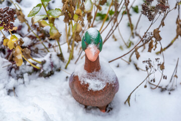 Funny figure in the courtyard of the Villa Lana Hotel. The idea of decorating a yard or garden in a snowy winter. Zelenogradsk, Russia