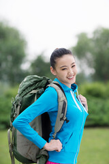 Young woman with backpack in outdoor