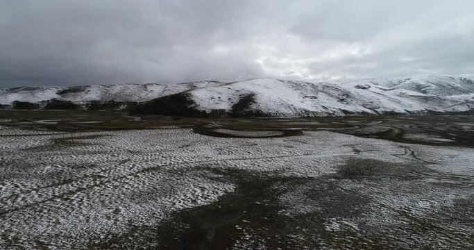 Aerial photography of the natural scenery of the wetland after the snow. Zoige, Ngawa Tibetan and Qiang Autonomous Prefecture, Sichuan, China