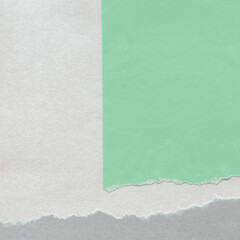 Colorful torn paper collage close-up. Texture made from various paper and cardboard parts. Damaged...