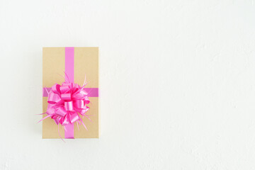 Closed gift box with decorations on a white background. Copy space.