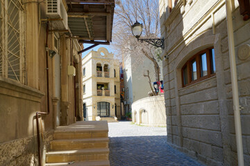 Fototapeta na wymiar Azerbaijan, Baku, the historical centrer with traditional houses and narrow cobblestone street.