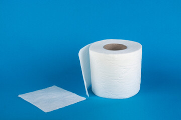 Roll of toilet paper on a blue background.