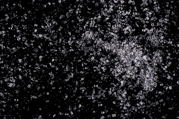 Cane sugar isolated on a black background.