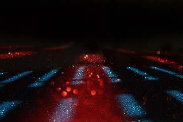 background of abstract blue, red and black glitter lights. defocused