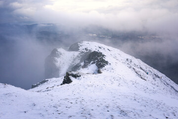 Fototapeta na wymiar Snowy view from the top of Aiako Harriak mountain on the Basque Country.