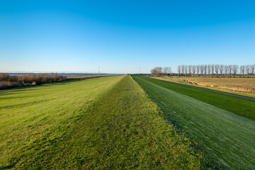 Wedel, Germany, near Hamburg. The dyke of the river Elbe close to Schulau on a sunny winter day.