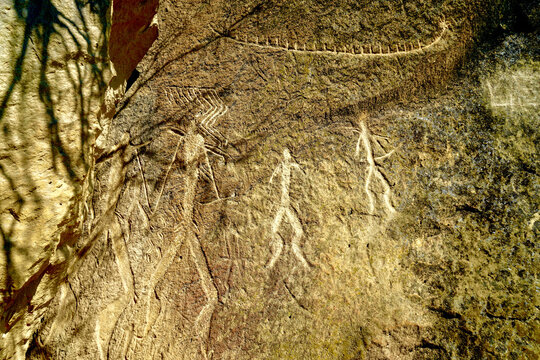 Azerbaijan, Petroglyphs, in Qobustan, Unesco World Heritage Site, tribal dancing men and women as well a reed boat