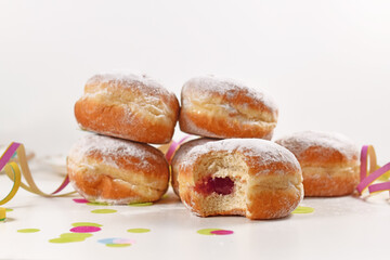 Traditional German donut like dessert called 'Berliner Pfannkuchen' filled with jam made from sweet yeast dough fried in fat. Traditional served during carnival.