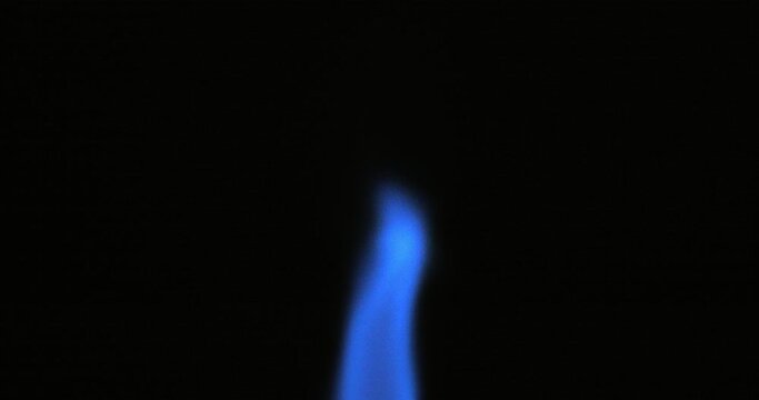 Gas flame isolated on black background. Blue fire shot on RED camera.