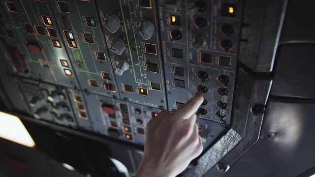 Autopilot control element of an airliner.Panel of switches on an aircraft flight deck. Thrust levers of a twin engined airliner. Pilot controls the aircraft. Onboard computer, cockpit.