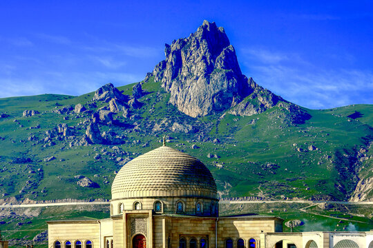 Azerbaijan, on the way to the village of Xinaliq, high up in the northern Caucasus mountains. The Beshbarmag Daghi (Five-finger mountain ) and nearby mosque.