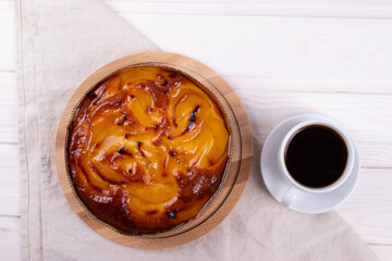 traditional homemade baked cake or tart and espresso in a cup