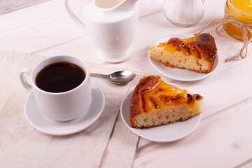 traditional homemade baked cake or tart and espresso in a cup