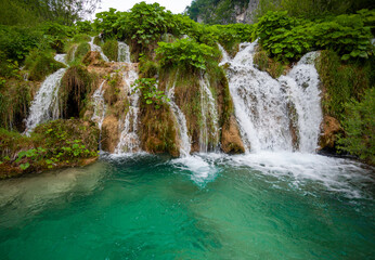 Fototapeta na wymiar Beautiful waterfall in Plitvice lakes national park in Croatia