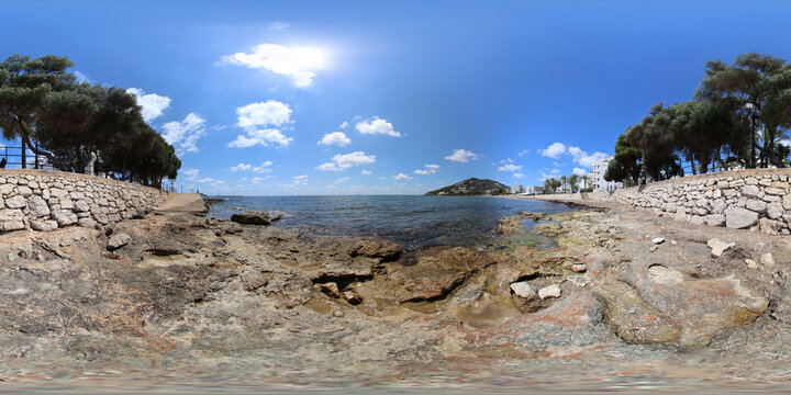360 Degree panoramic sphere photo of the beautiful beach front of Ibiza in Spain showing the Spanish beach front on a bright sunny summers day