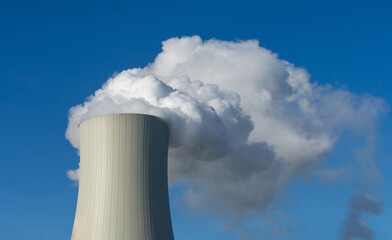 smoke from a chimney, huge industrial or power plant cooling tower chimney