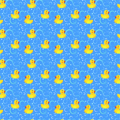 Bathroom background, yellow rubber ducks on a blue background with soap bubbles, children's background