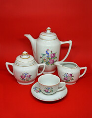 Vintage porcelain coffee set: coffe pot, milk pot, sugar bowl and cup