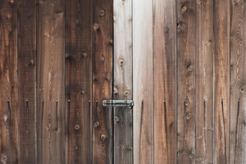 Fototapeta premium Old weathered wooden door with lock