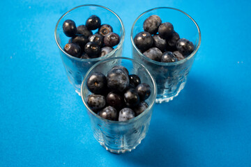Fresh blueberries in a glass vase