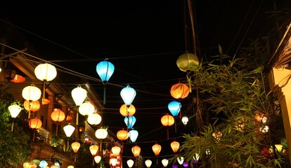 Night view of Colourful cloth lanterns lamp light shades hanging outside in Hoi An, Vietnam - ランタン 夜景 ホイアン ベトナム © Eric Akashi