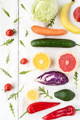View of colorful fresh raw vegetables and fruits for a healthy diet. Flat lay on grocery set