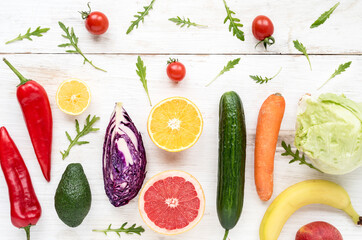 View of colorful fresh raw vegetables and fruits for a healthy diet. Flat lay on grocery set