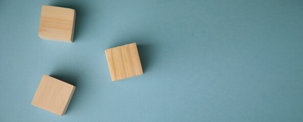 Blank wooden cube on the table.