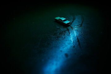 Model of a toy car in the dark.