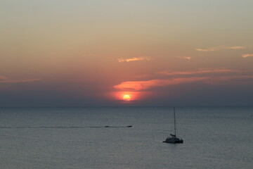 Sun set by the Beach the reflection of the sun beam on the ocean is very beautiful