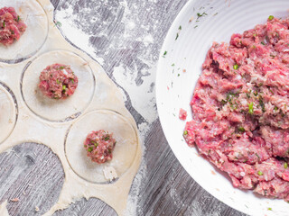 background of homemade meat dumplings or ravioli with meat