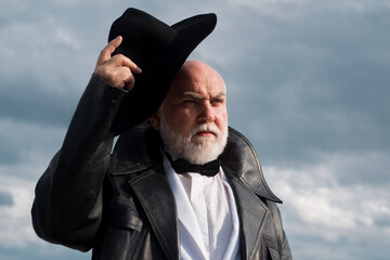 Handsome fashion senior old mature man. Elderly mature greybeard. Close up face portrait of senior....