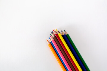 Close Up colored wooden pencils. Isolated on white background.