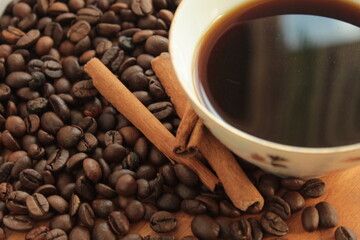 coffee beans and cup and cinnamon