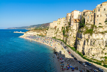 View of Tropea, a popular seaside resort town in Calabria region with old buildings built on the cliffs overlooking the sea, Italy