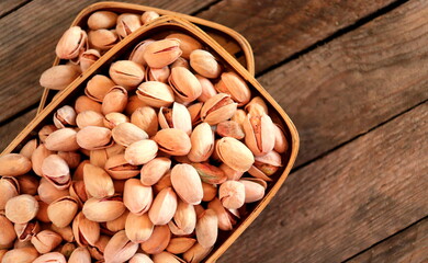 pistachio nuts close-up on a wooden surface selective focus.