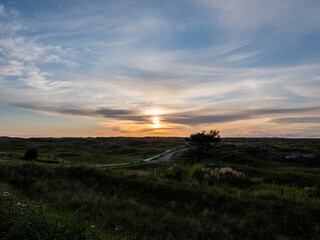 Sunset over the dunes on the island of Ameland.