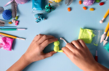 Fototapeta premium how to make a figurine from plasticine bunny step by step step 2 selective focus. children's crafts. handwork.