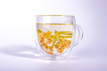 Linden tea in the double wall glass cup.