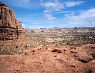 Dazzling Arches National Park in the summertime with sandstone formations on a partly cloudy day in Utah