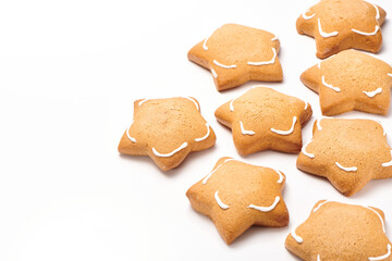 Freshly baked star shaped ginger cookies isolated on white background