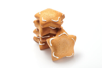 Freshly baked star shaped ginger cookies isolated on white background