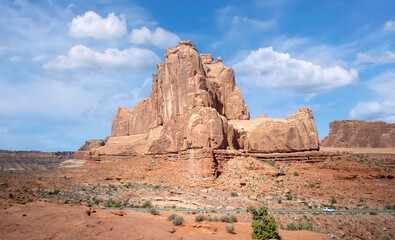 Fototapeta premium Dazzling Arches National Park in the summertime with sandstone formations on a partly cloudy day in Utah