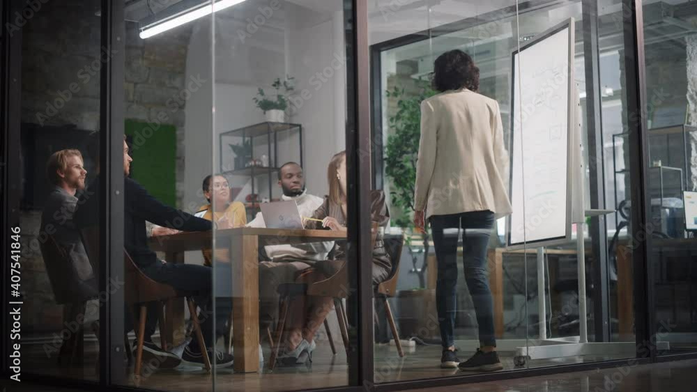Aufkleber Project Manager Makes a Presentation for a Young Diverse Creative Team in Meeting Room in an Agency. Colleagues Sit Behind Conference Table and Discuss Business Development, User Interface and Design.