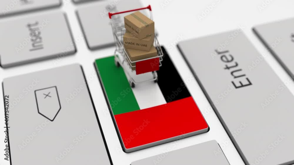 Poster cartons with made in uae text and shopping cart on the computer keyboard. conceptual looping 3d anim