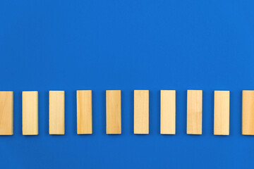 Template for business vision and development concept, blue background, copy space, vertical wooden blocks
